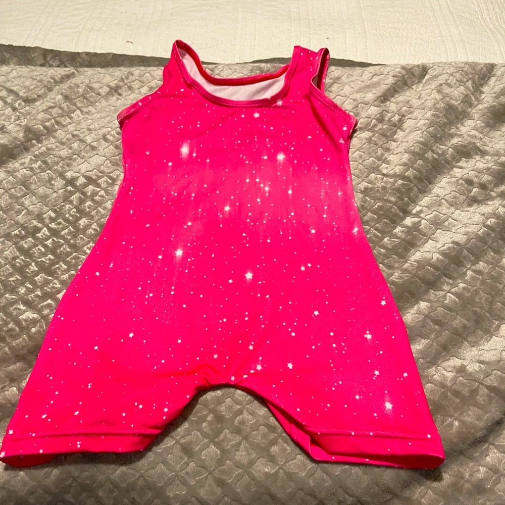 Pink romper with stars.